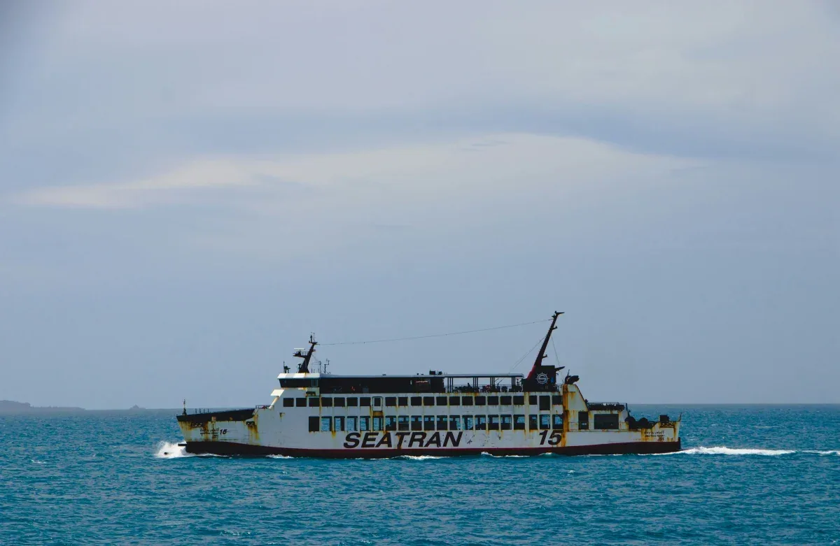 Seatran ferry boat cruising through deep blue ocean waters in the Gulf of Thailand, providing island hopping transportation between Koh Samui and neighboring islands