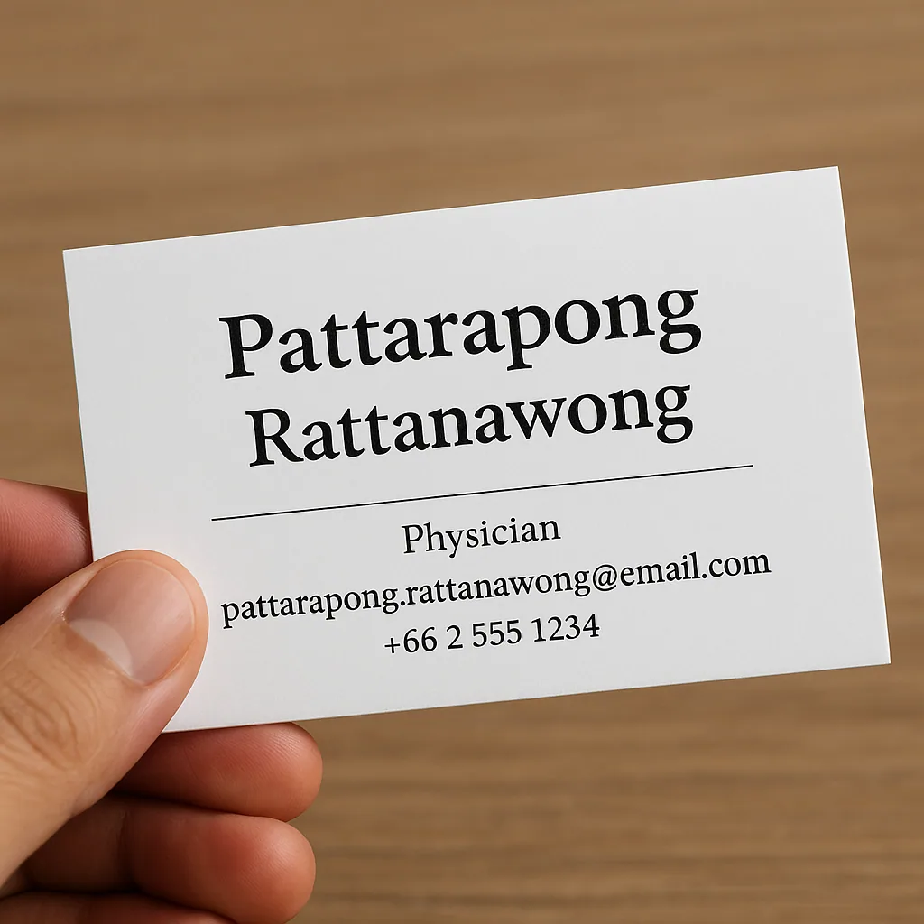 Thai business cards showing prominent first names with smaller surnames, illustrating Thai naming hierarchy and professional etiquette